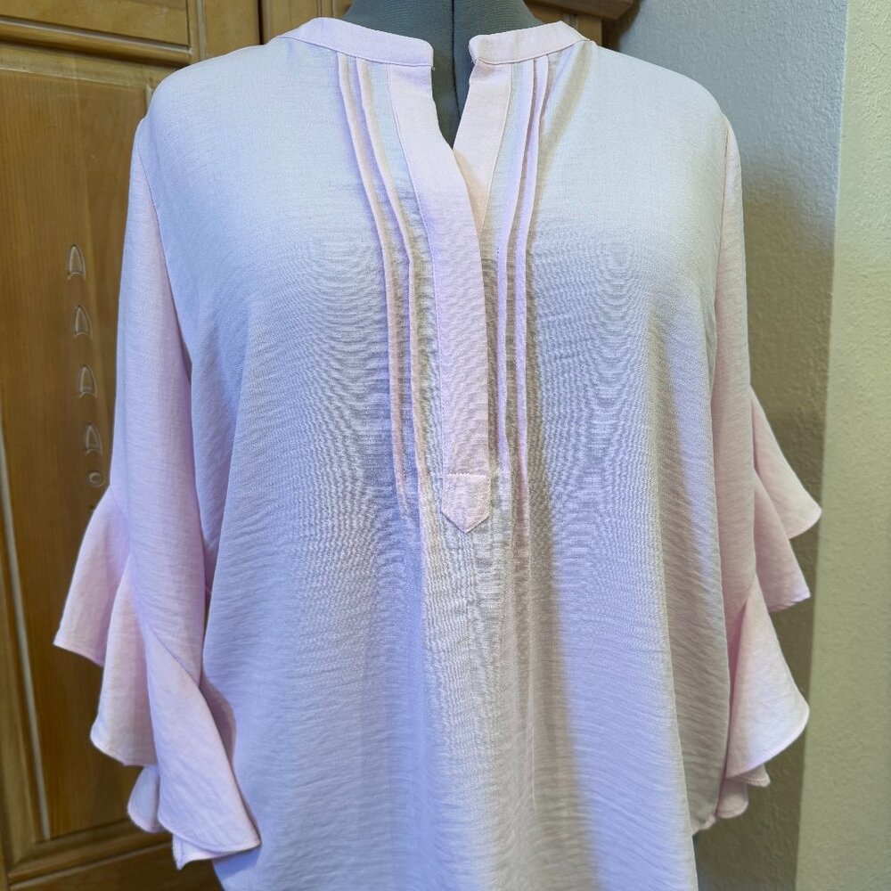 Beautiful Light Pink washable Blouse with sleeves that ruffle at the elbow.